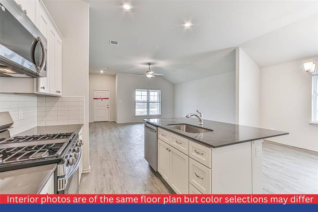 This kitchen is truly the soul of the home. With its open layout and charming design, it invites you to enjoy cozy breakfasts or host memorable dinner parties. The dining area provides the perfect setting for cherished conversations and laughter-filled moments.