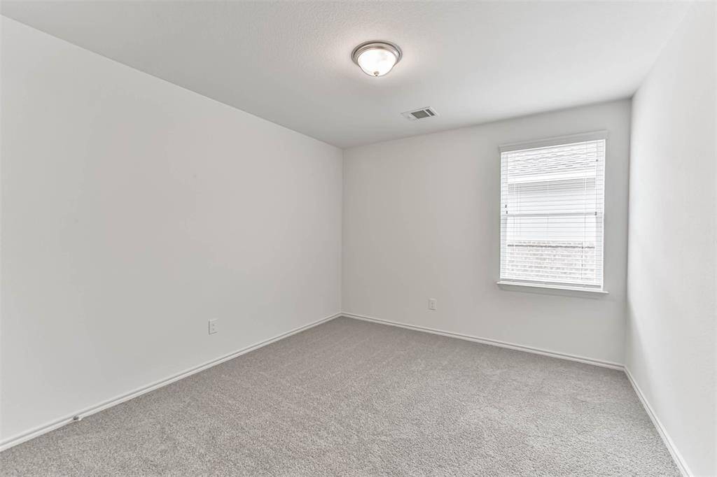 This versatile bedroom is a canvas awaiting your personal touch. With its generous size and abundant natural light, it presents endless possibilities as a home office, playroom, or an additional cozy retreat for guests.