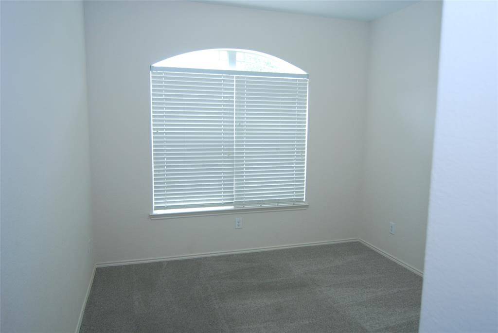 Secondary bedroom 3.  This one faces the front yard, would make a nice home office!