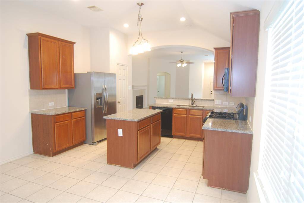 Another view of the kitchen - tiled floors for easy maintenance.