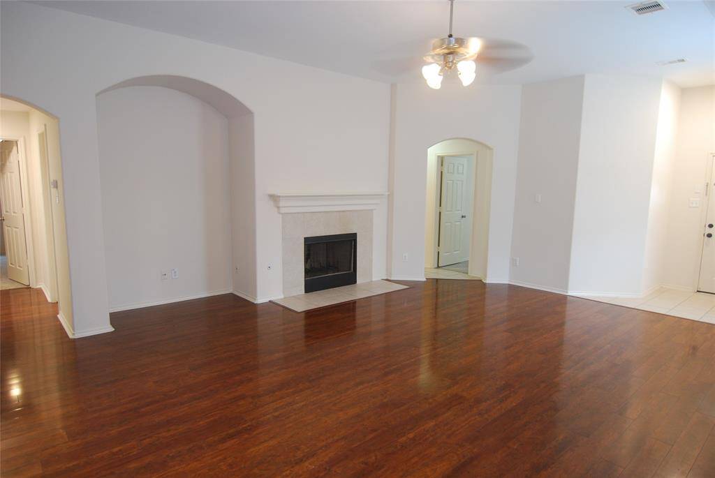 Back to the living area- gas log  fireplace, and notice the two hallways..