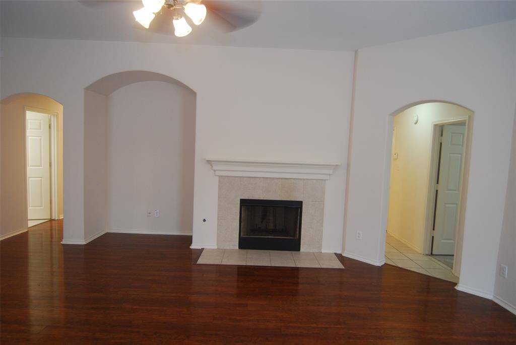 The left hallway leads to the laundry, primary bedroom, and another bedroom.   The right hallway leads to two bedrooms.  One could be used as a home office.