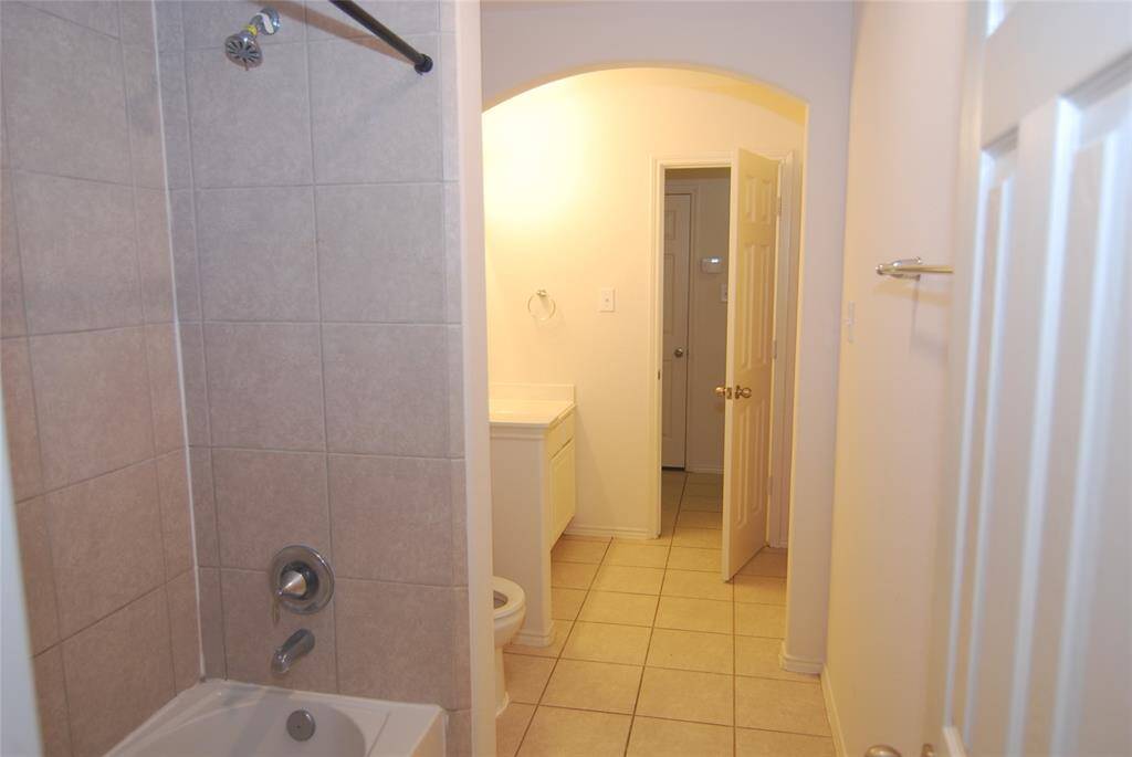 This is the guest bath that connects between the two hallways making easy access for all the bedrooms.