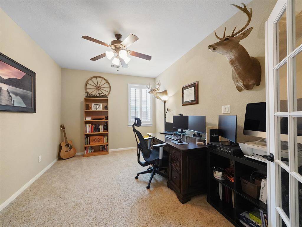 The office has beautiful french doors! Could also be used as a play room if you choose to utilize the space that way.