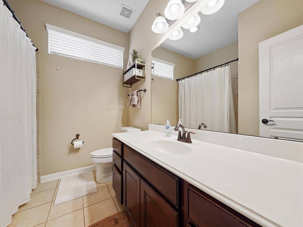 Secondary bathroom has plenty of counter full shower/tub combo.
