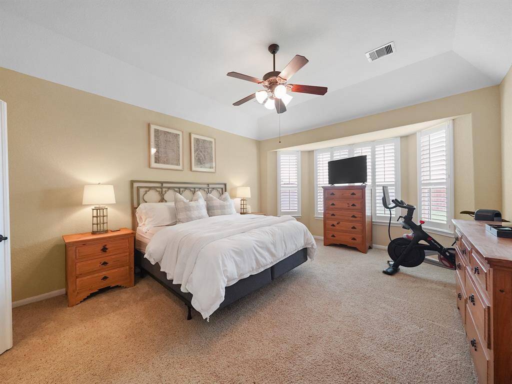 Expansive primary bedroom with space for a sitting area, reading nook, or vanity station.