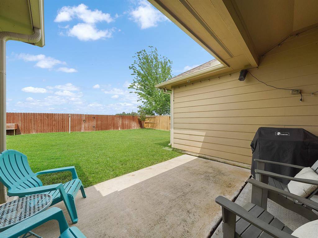 Private backyard retreat with patio space perfect for outdoor grilling and relaxation!