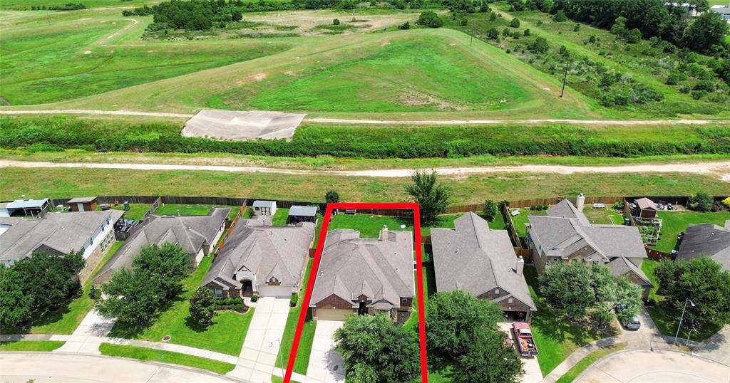 This aerial photo shows the beautiful green space with a trail, offering a scenic and peaceful backdrop.