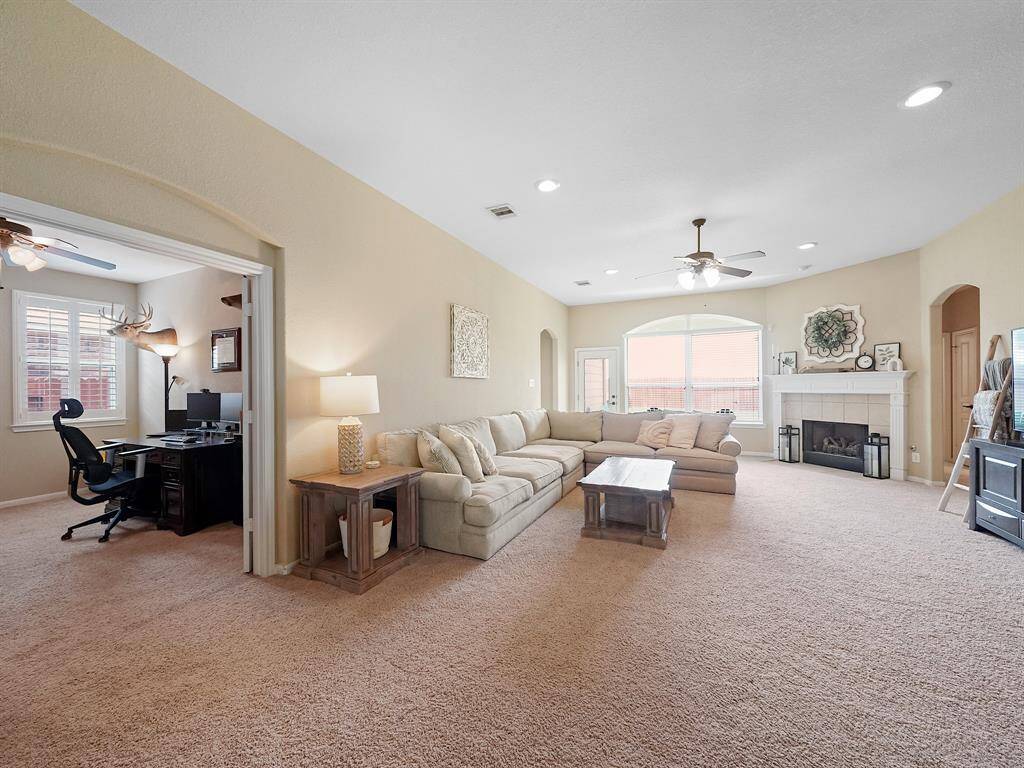 Another view of the living room, showing you just how well this floor plan flows throughout! Side area view of the office.