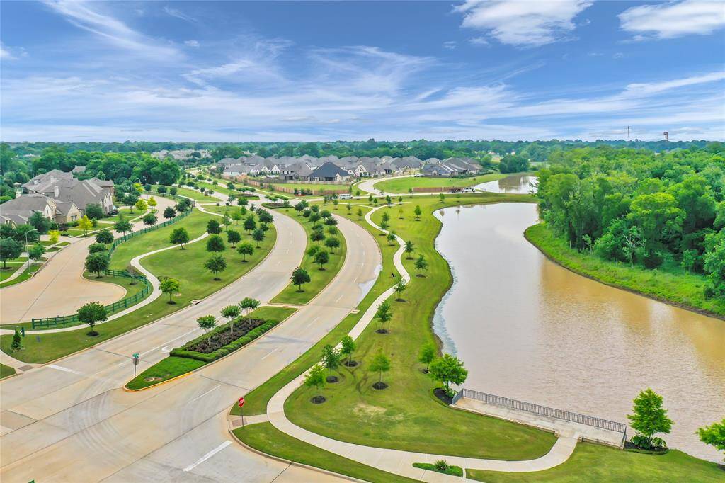 Winding streets with mature trees enhance this delightful community.