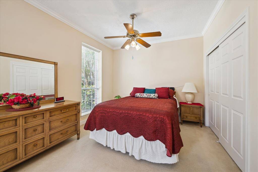 The original garage has been converted to living quarters that has two private rooms, this one currently serving as a bedroom, and a full bath. Two entry doors provide direct access to the quarters.