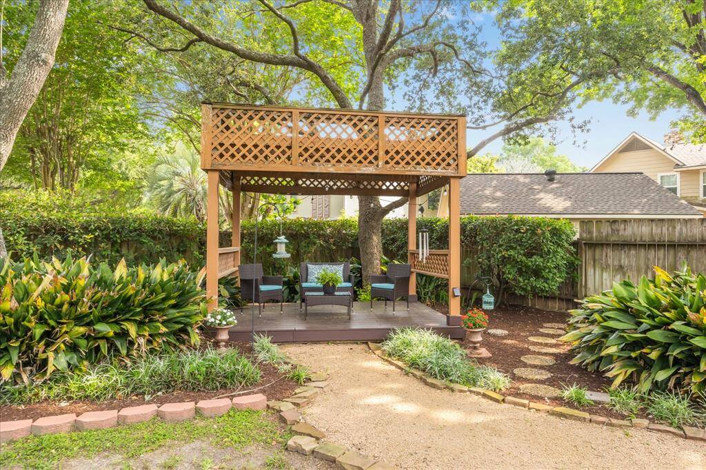 One of the backyard features is a covered seating area.