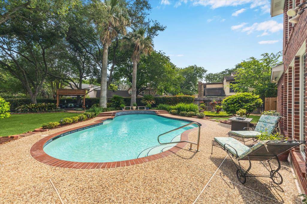 The pool is surrounded by a large amount of concrete surface area.