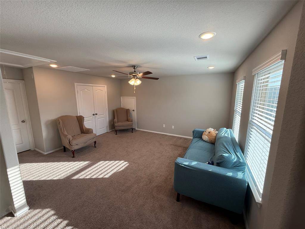 Spacious upstairs game room, perfect for entertainment and relaxation.