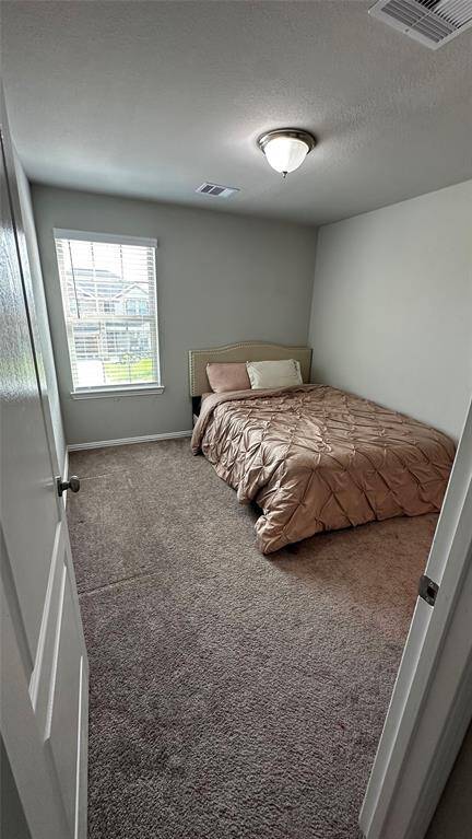 Upstairs, discover cozy secondary bedrooms perfect for family or guests.