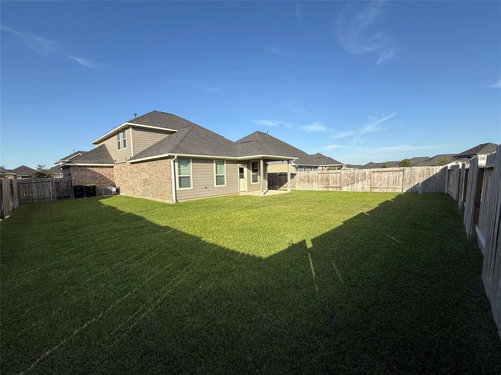 Spacious backyard perfect for family gatherings and relaxation.