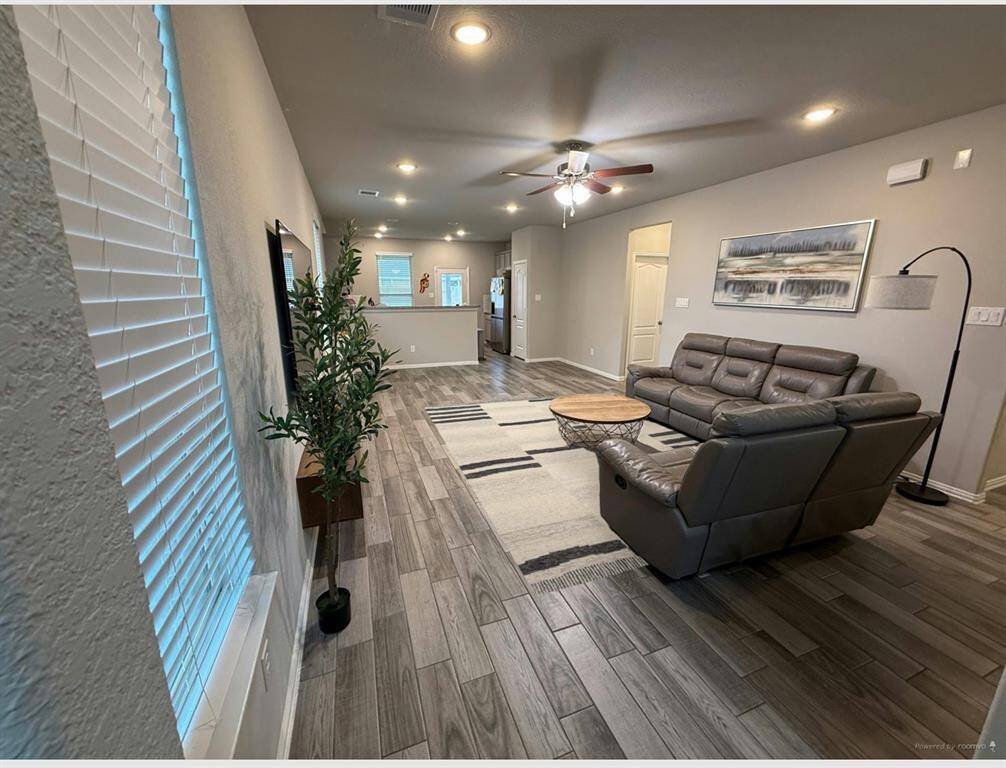 Experience modern living with this inviting open floor plan, perfect for seamless entertaining and comfort.