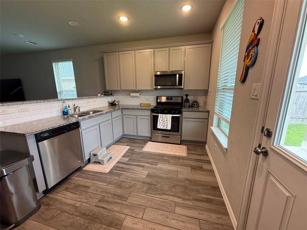 Modern kitchen featuring sleek appliances and elegant design.