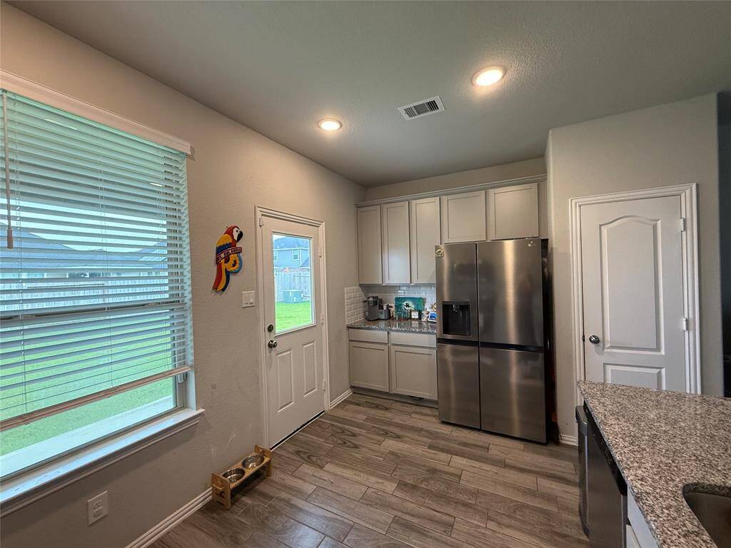 Access the inviting covered patio directly from the kitchen.