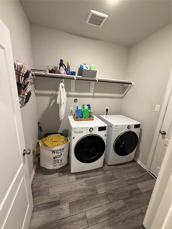 Modern laundry room with included appliances.