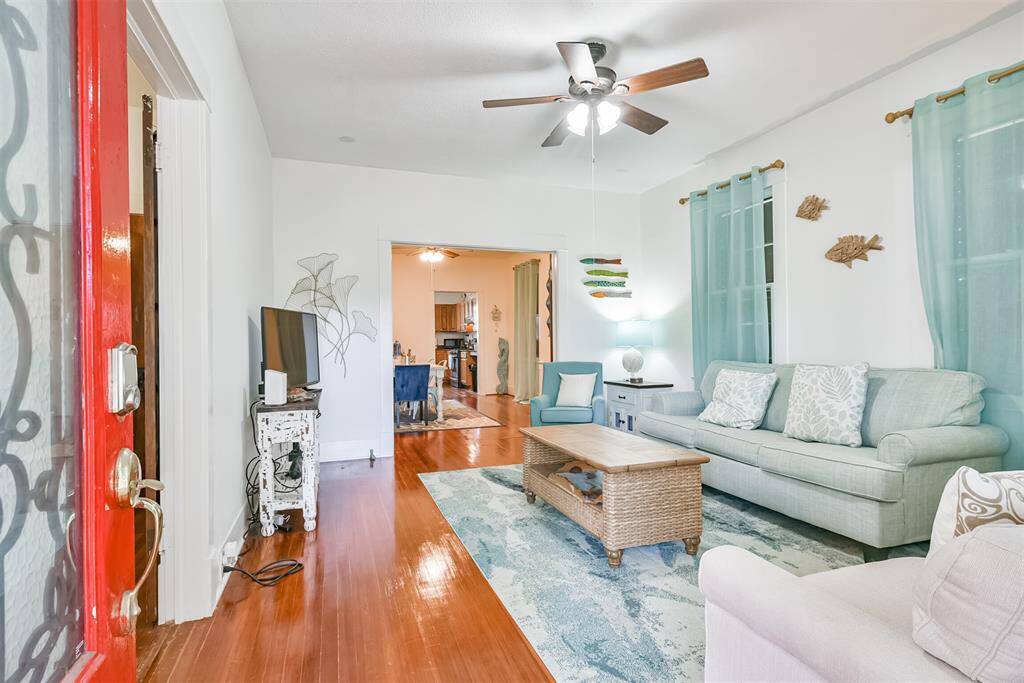living room facing dining room and kitchen