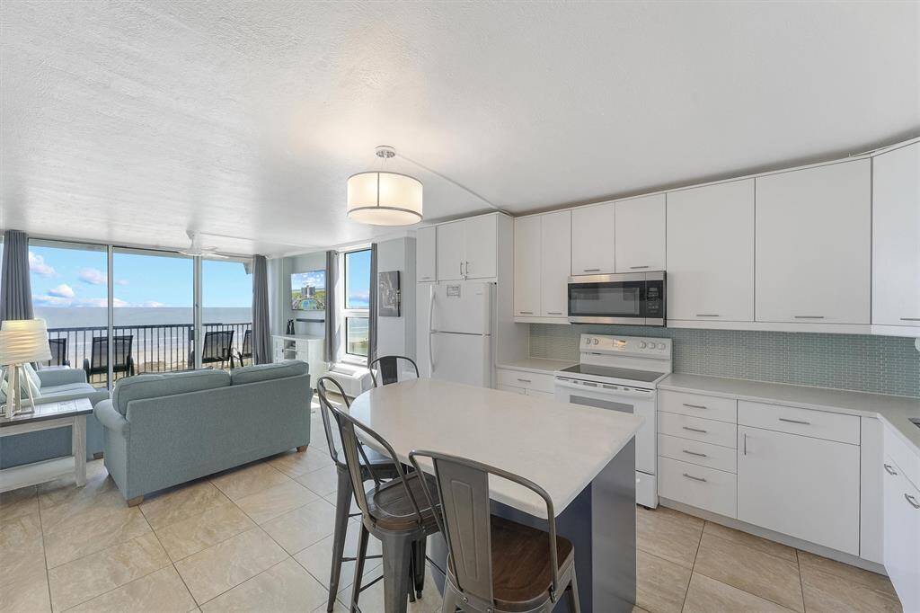 Kitchen and living room offer open concept living with picturesque views