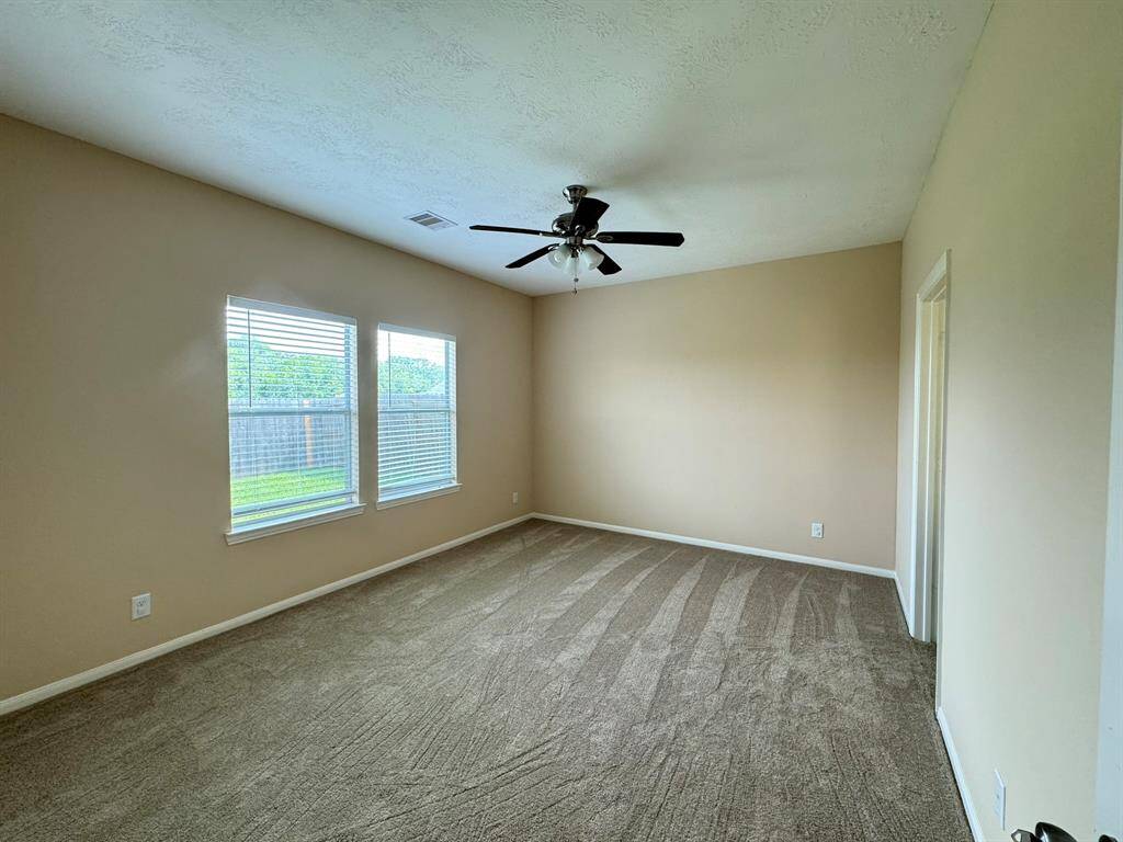Large primary bedroom with extra closet