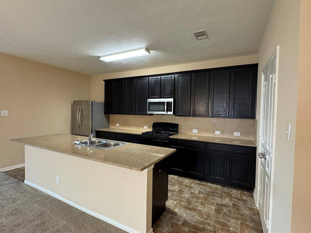 Large kitchen island good for prepping meals and dining