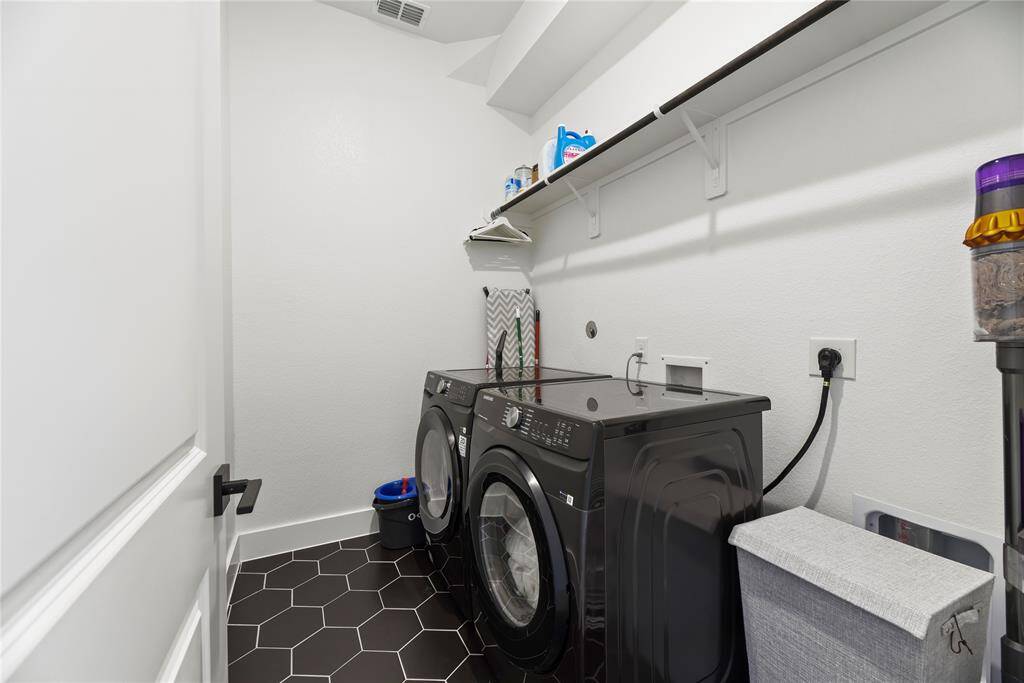 The laundry room is on the first floor and the washer and dryer will stay.