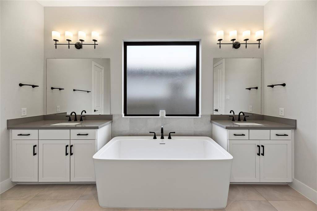 Double vanities with ample storage space.