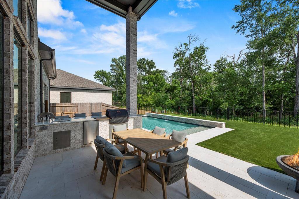 Outdoor kitchen and covered patio.