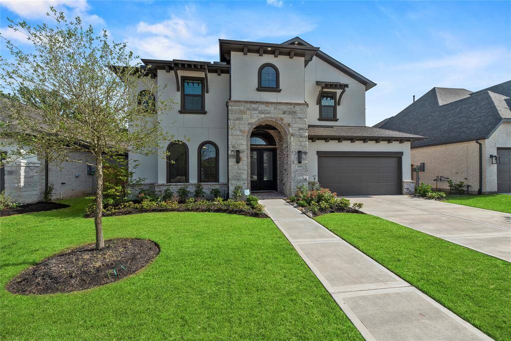 Stucco, stone and brick exterior.