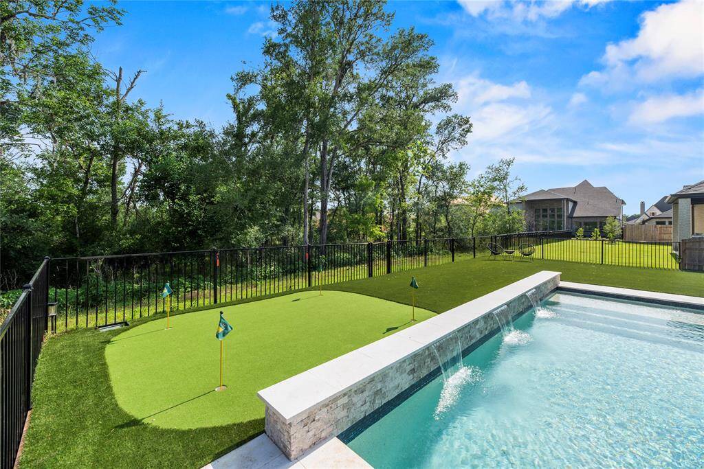 Putting green and water features on the pool.