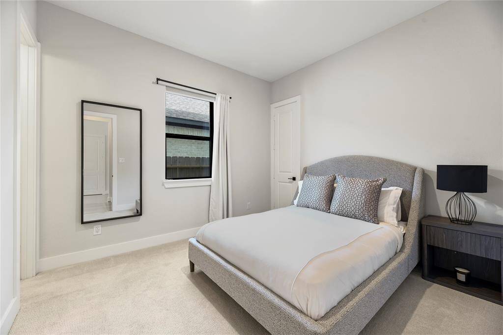 There is a guest suite with it's own private bath and walk-in closet on the first floor.