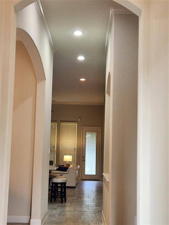 Step into this elegant one-story with sky-high ceilings and designer finishes