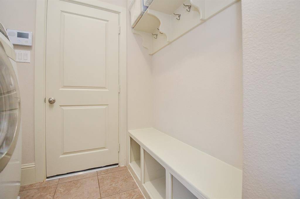 The utility room also doubles as a convenient mud room for busy comings and goings.