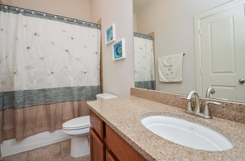 This full bath hosts combined shower/bathtub for easy personal options.