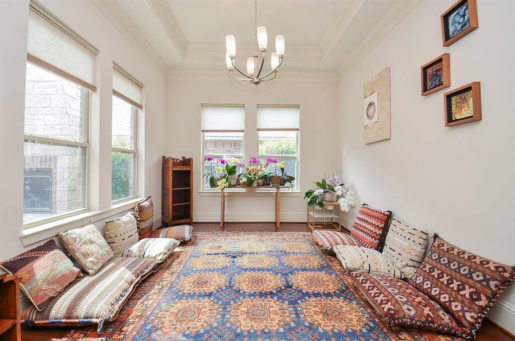 Be creative and fulfill your lifestyle preferences in another, naturally lit, flex, room, embraced by an intimate tray ceiling, above.