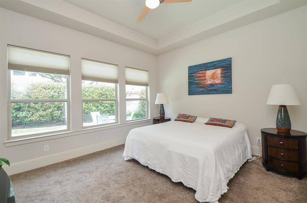 Your huge, carpeted primary suite offers a wall of windows and tremendous wall/floor space for beloved large and small peaceful accents that make this your private oasis.