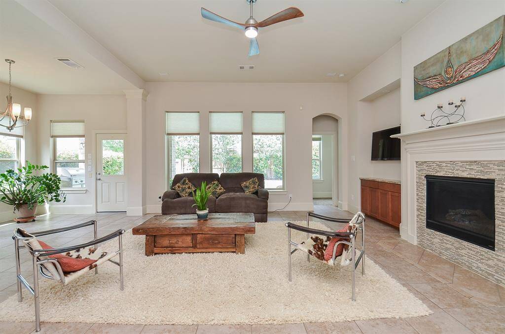 Even in a space of this size, you can still create a cozy vibe, with your chosen placement of furnishings. And --- just picture this wide open space at holiday time, filled with colorful decorations and people, all gathered around the built-in fireplace.