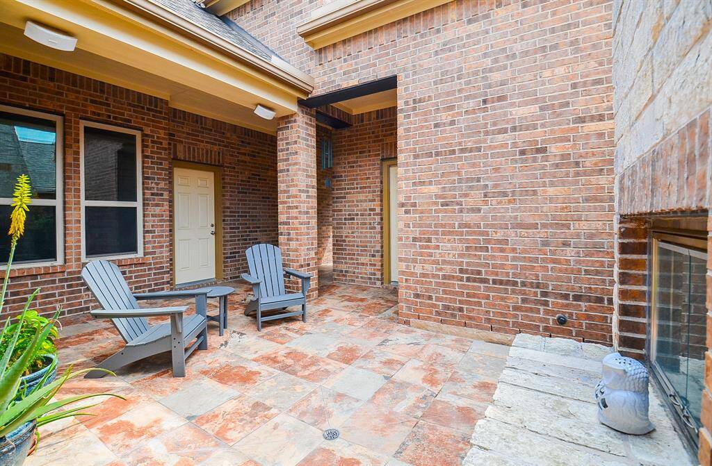 The outdoor, covered front patio (appearing much like a hidden courtyard) encourages you to bring your lovely indoor lifestyle, outdoors, to the perfect family and friend entertaining space.