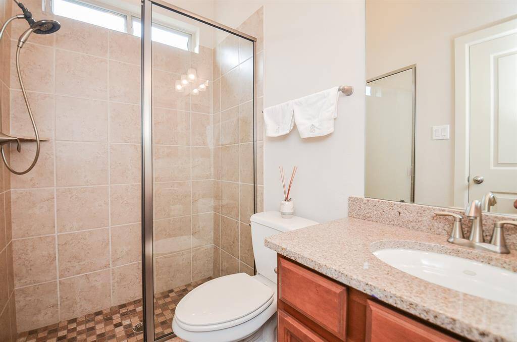Subtle earth tones fill this bathroom and inviting walk-in shower.