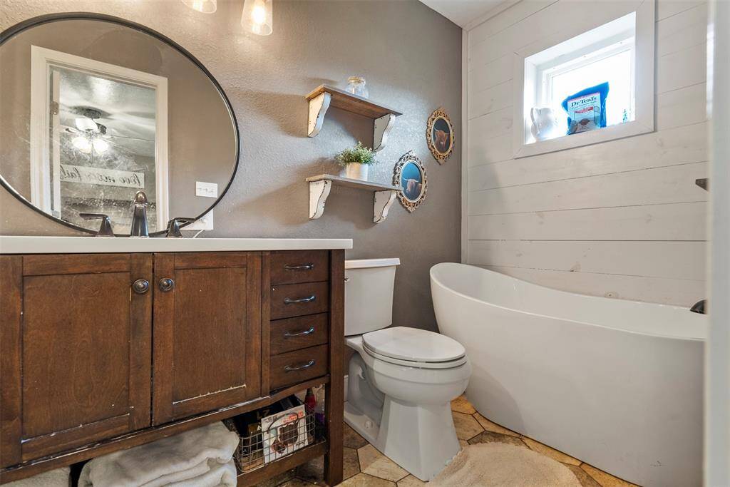 Primary bathroom with separate tub and shower.