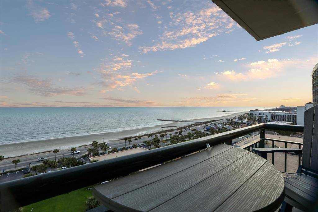 Showcasing a serene beachscape and a beautiful sky at dusk.