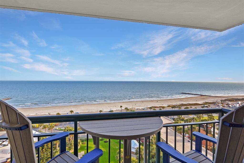 Seeking a waterfront lifestyle? This view is unbeatable! Showcasing the remarkable 12th floor balcony view from your private covered balcony, offering an expansive overlook of a serene beach and the ocean.