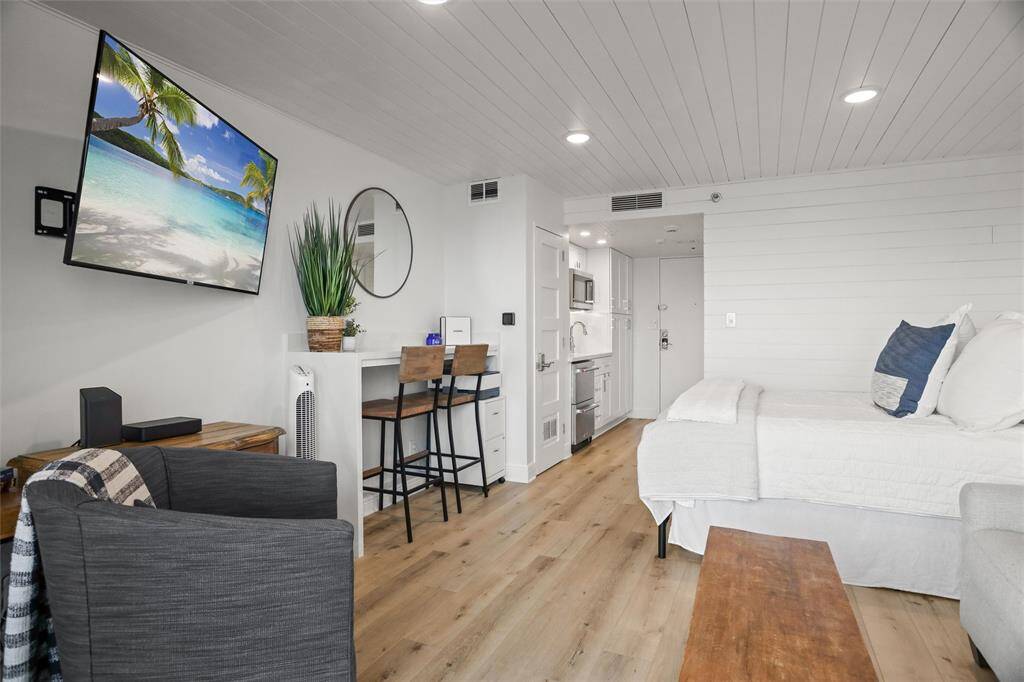 Offering a  well-appointed kitchenette, the space is efficiently utilized with a comfortable seating area, mounted flat-screen TV, and a sleeping space for four. Ideal for a buyer looking for a stylish, compact living space.