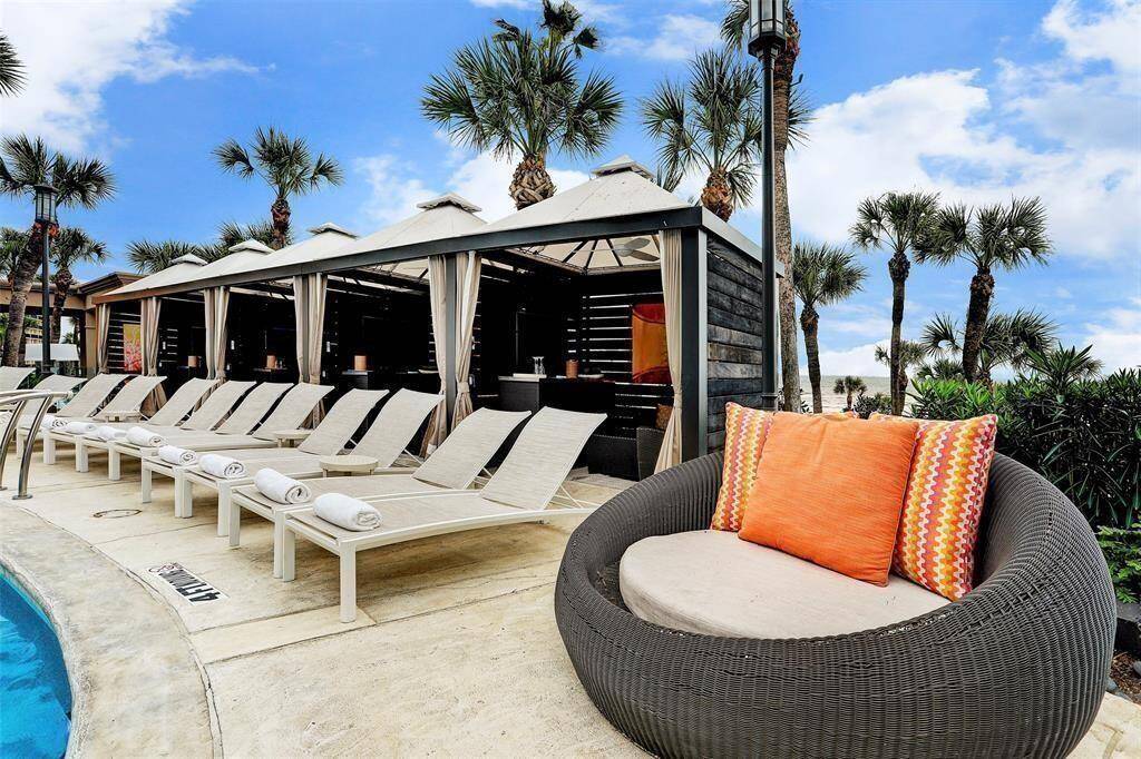 This is an inviting poolside lounge and cabannas are available for reservation.
