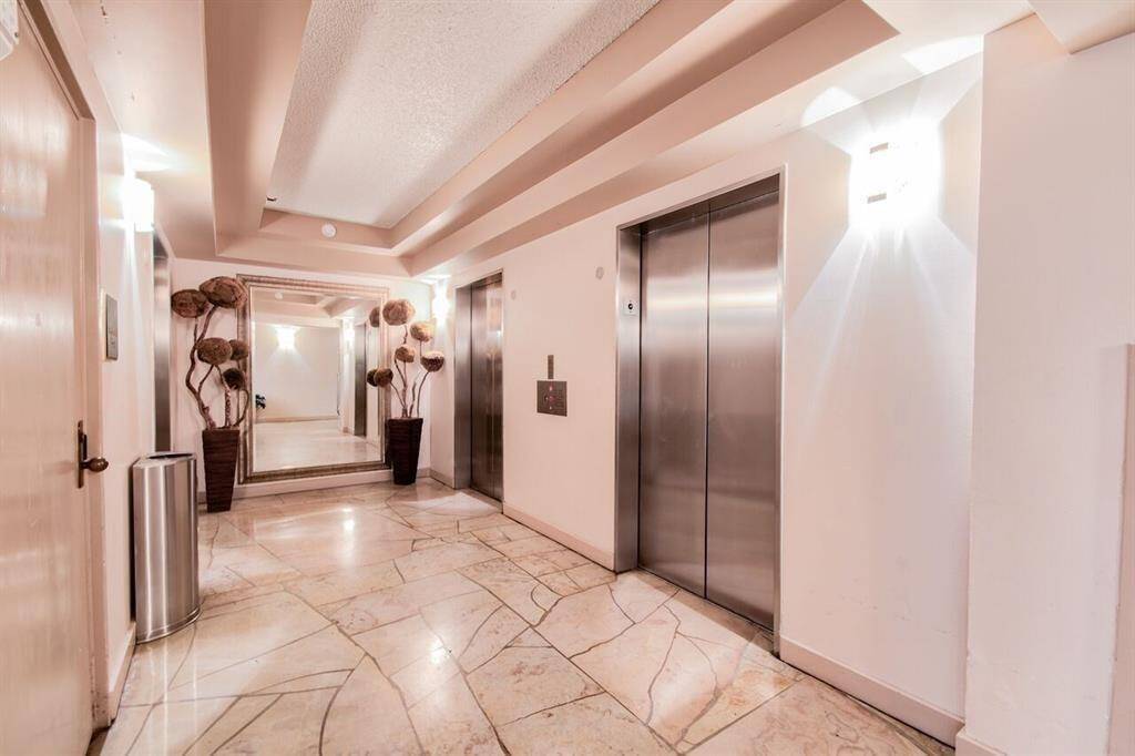 This elegant lobby area featuring marble flooring leading to the condominium elevators and owners parking garage.
