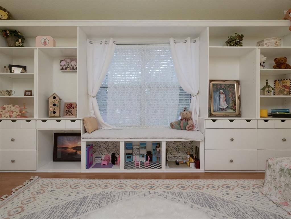 Check out the built in shelving and drawers with a large window with a cushioned seat. There is plenty of room for everything!