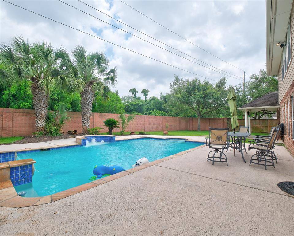 This beautifully designed backyard is perfect for outdoor relaxation and entertainment. Enjoy the solitude since there are no back neighbors! The River Park Walking Trails start beside this home!
